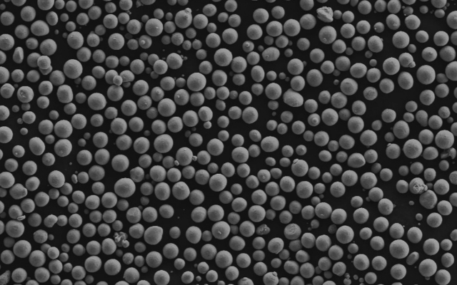 Close-up of spherical metal additive manufacturing powder feedstock particles
