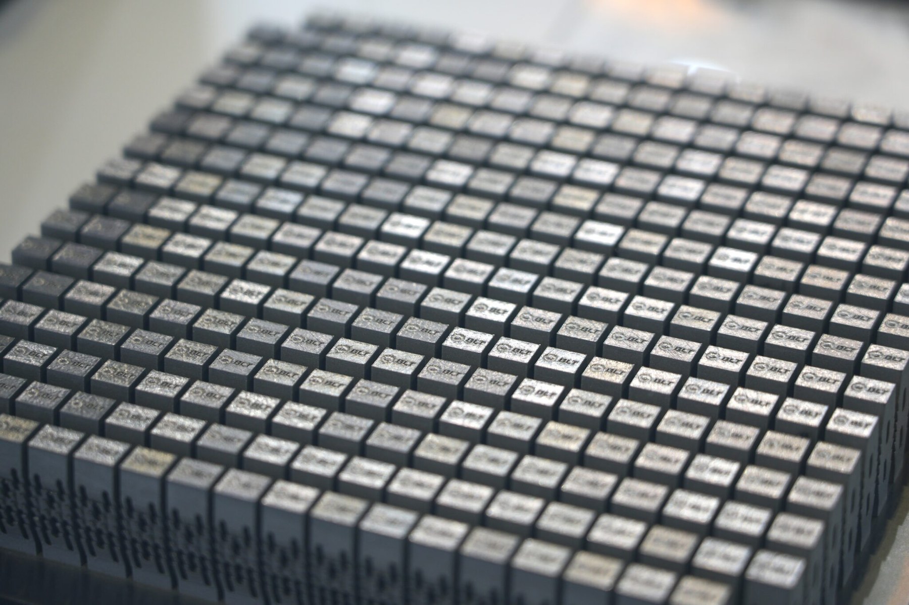 Large batch grid of identical metal additive spinal fusion cage blanks